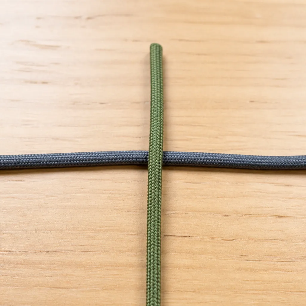 Diagram: two cords laid as a cross, vertical over horizontal